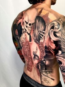 Full back skull and woman tattoo